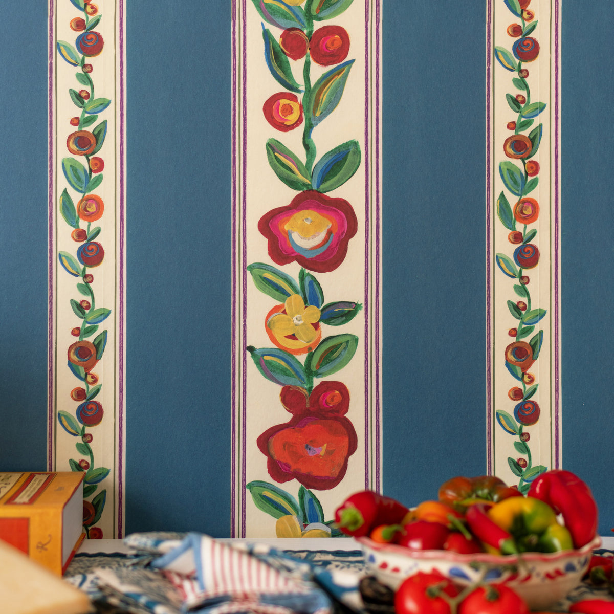 Dainty Flowering Azure wallpaper by MINDTHEGAP, close-up in a styled interior.