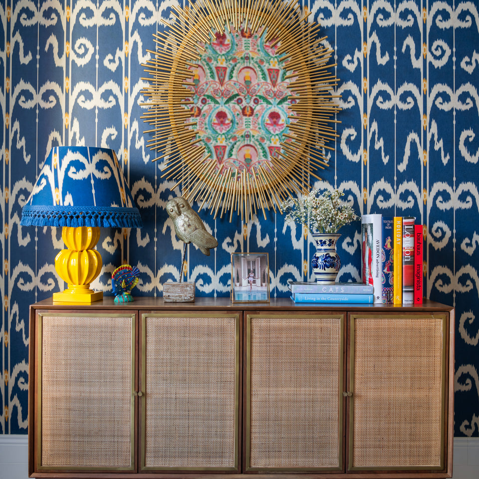 Elysia Ikat Celestial wallpaper by MINDTHEGAP, shown in a furnished interior.