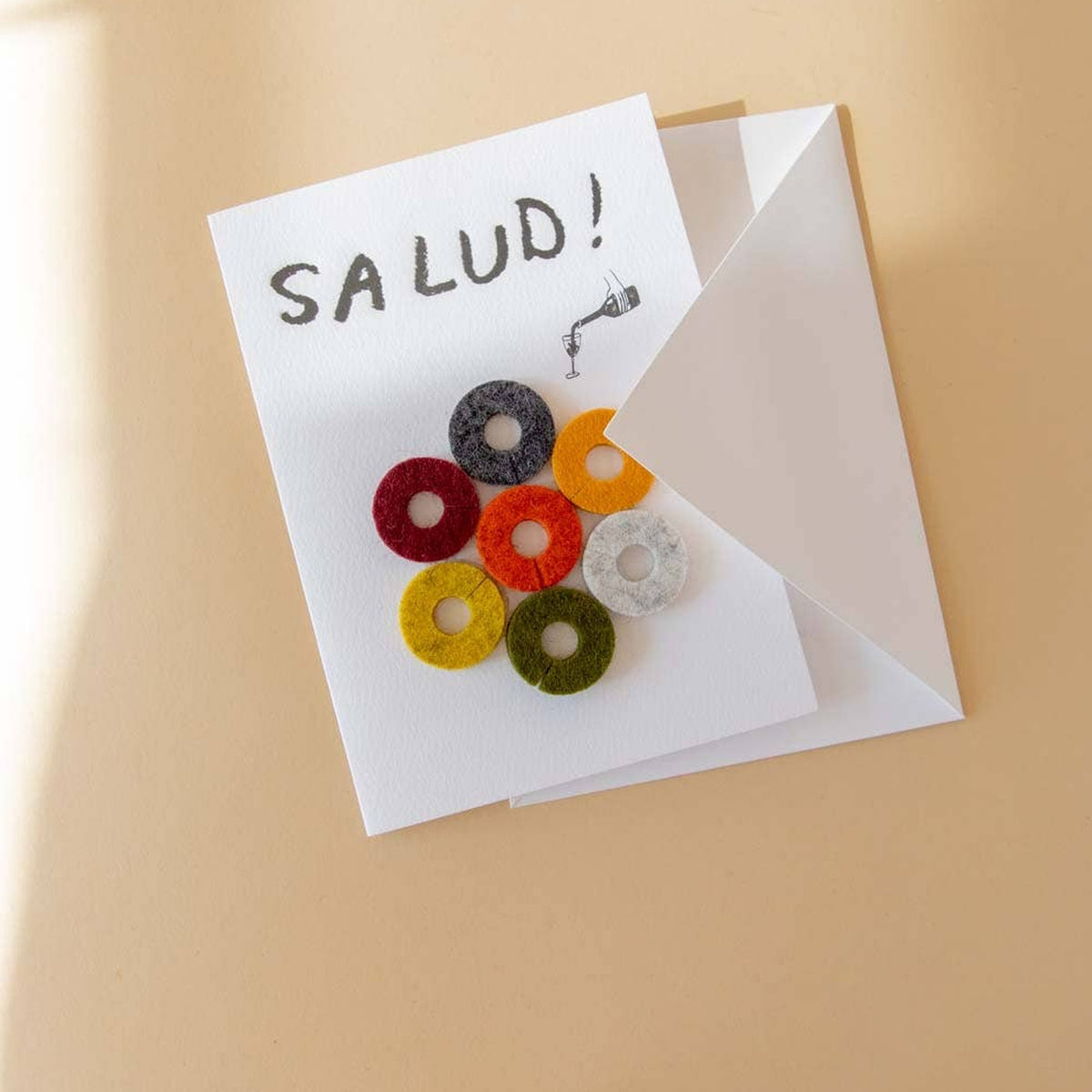 Graf Lantz Salud Wine-Ote’s card and envelope in warm sunlight