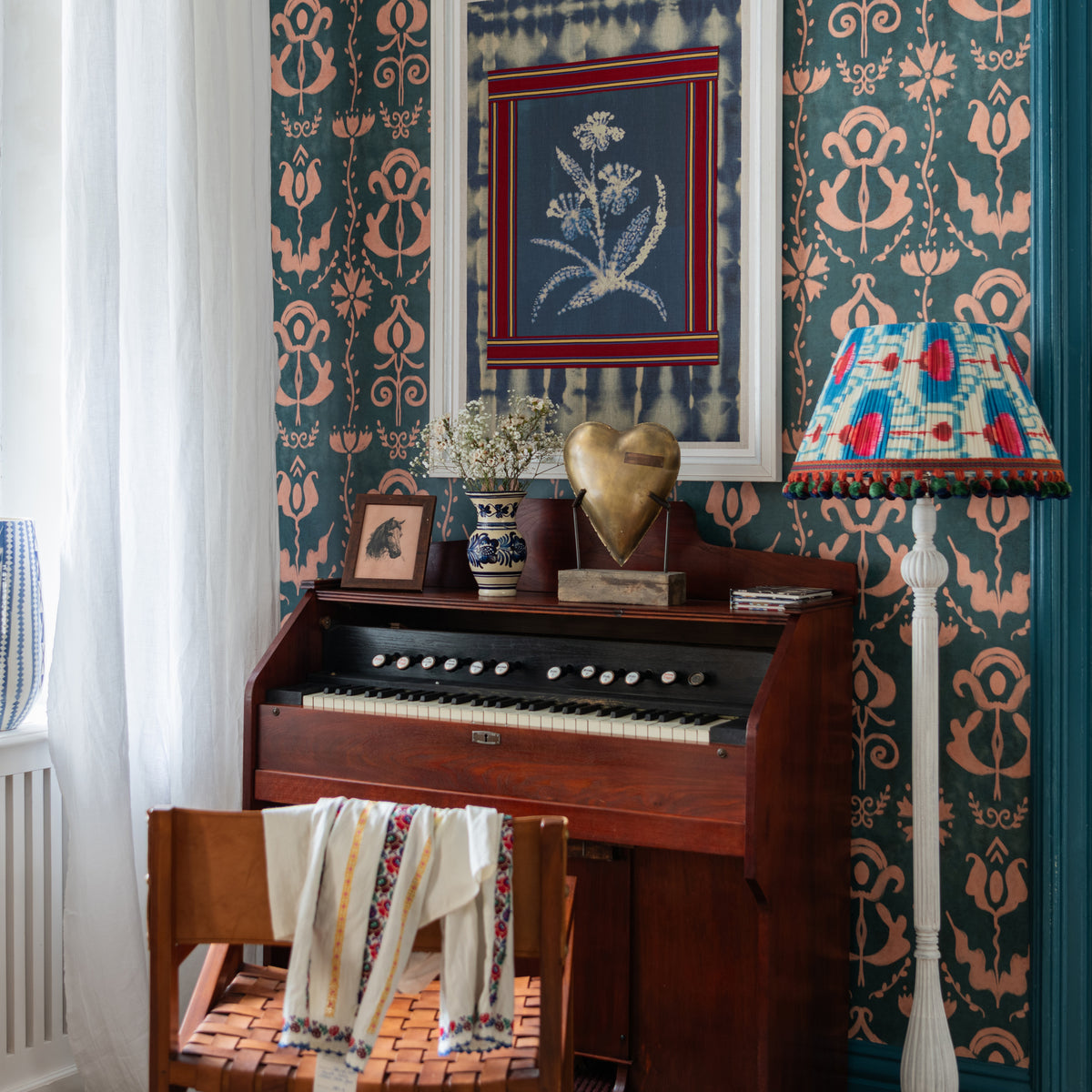 Grandma'S Stencil Milky Blue wallpaper by MINDTHEGAP, shown in a furnished interior.