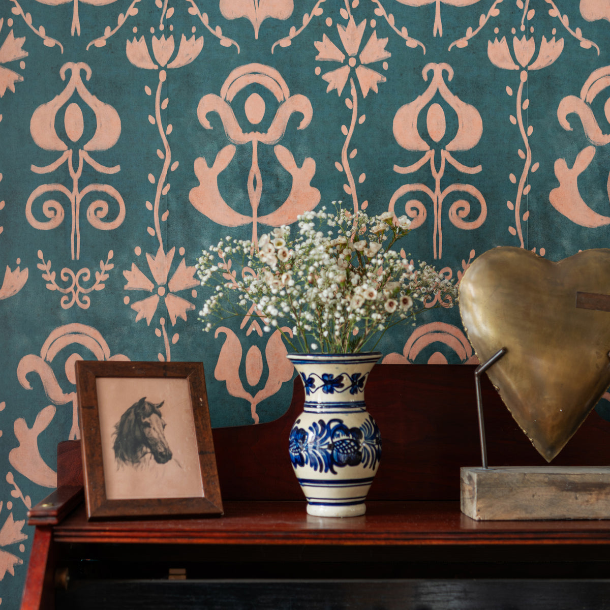 Grandma'S Stencil Milky Blue wallpaper by MINDTHEGAP, close-up in a styled interior.