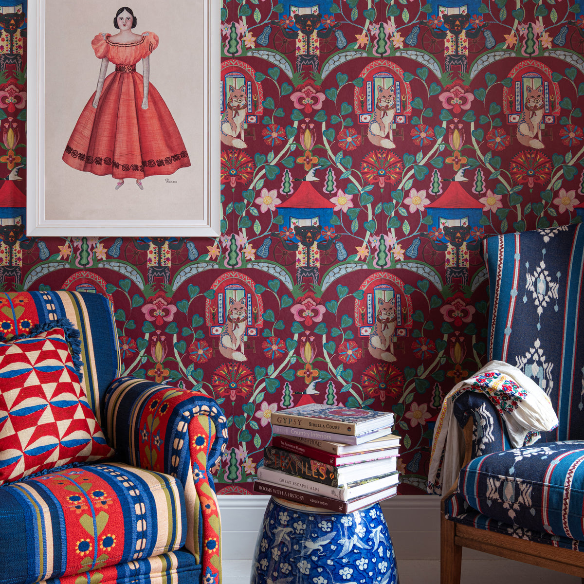 Gypsy Fairytale Ruby wallpaper by MINDTHEGAP, shown in a furnished interior.