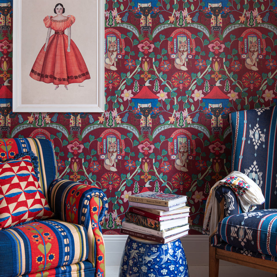 Gypsy Fairytale Ruby wallpaper by MINDTHEGAP, shown in a furnished interior.
