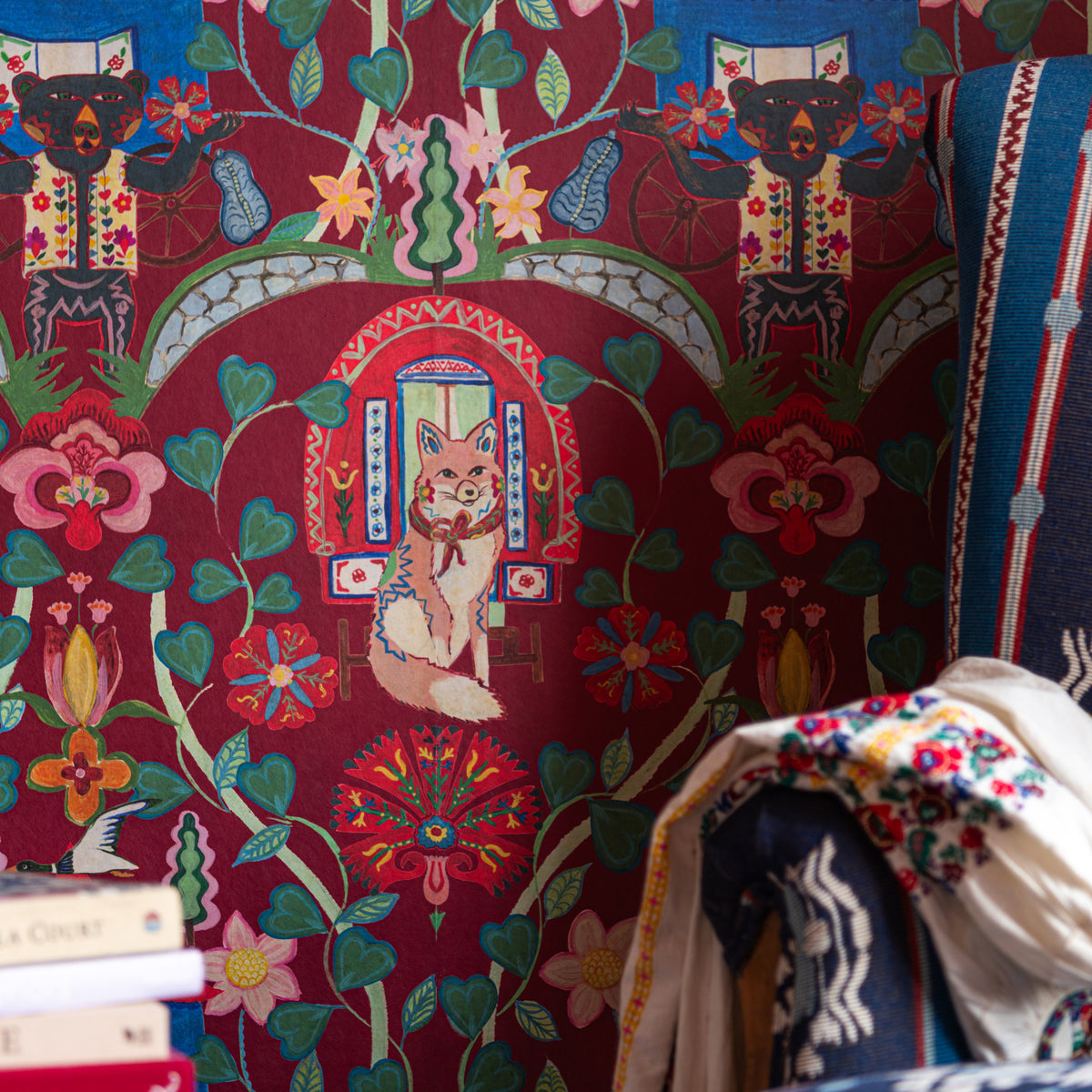 Gypsy Fairytale Ruby wallpaper by MINDTHEGAP, close-up in a styled interior.