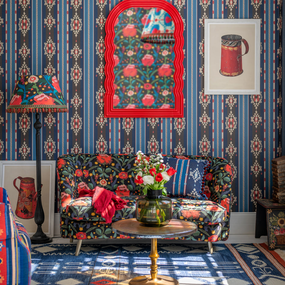 King'S Ikat wallpaper by MINDTHEGAP, shown in a furnished interior.