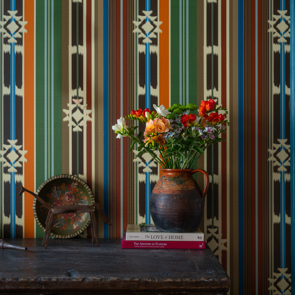 Mistletoe Poly wallpaper by MINDTHEGAP, close-up in a styled interior.