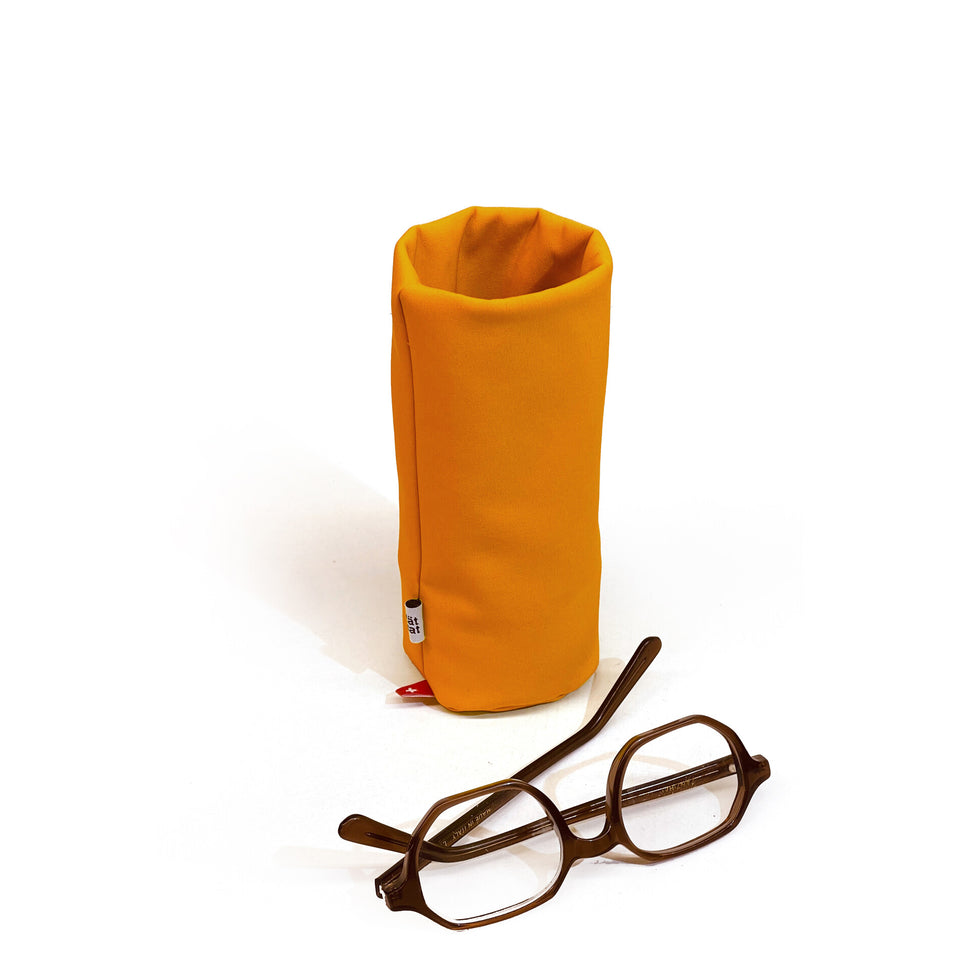 Fire orange Tat-Tat Sacco weighted storage pouch for glasses and desk accessories