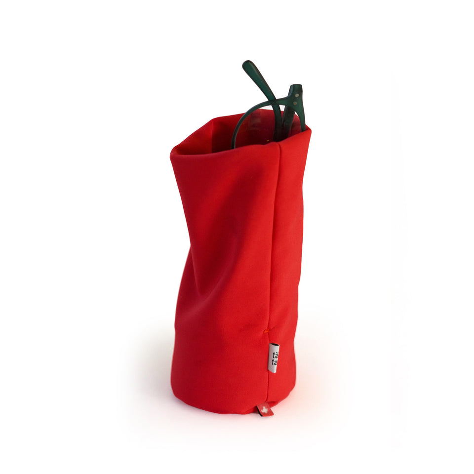 Red Tat-Tat Sacco weighted storage pouch for glasses and desk accessories