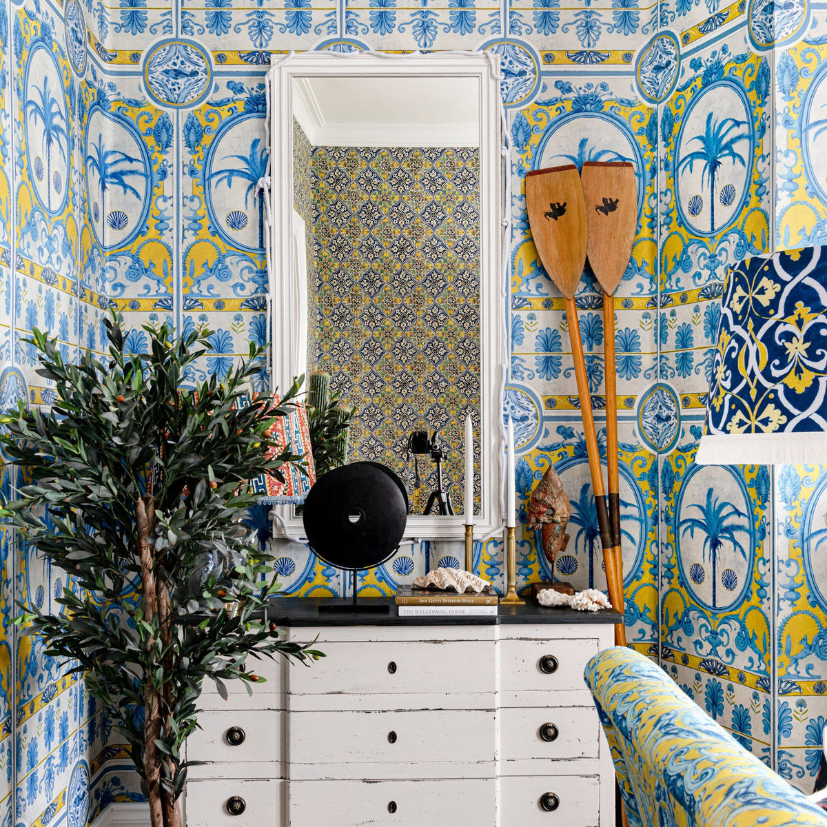 The Villa Mural Yellow wallpaper by MINDTHEGAP — room setting showing Yellow colorway