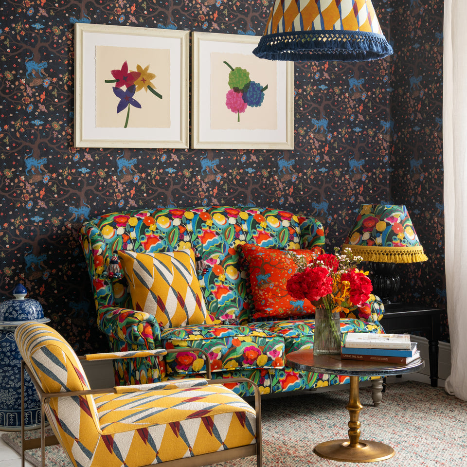 Tree Of Life Anthracite wallpaper by MINDTHEGAP, shown in a furnished interior.