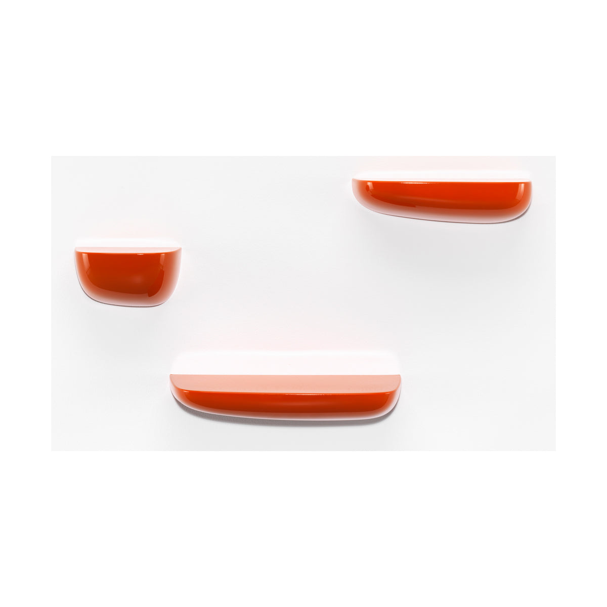 Orange Vitra Corniche shelves shown in small, medium and large sizes