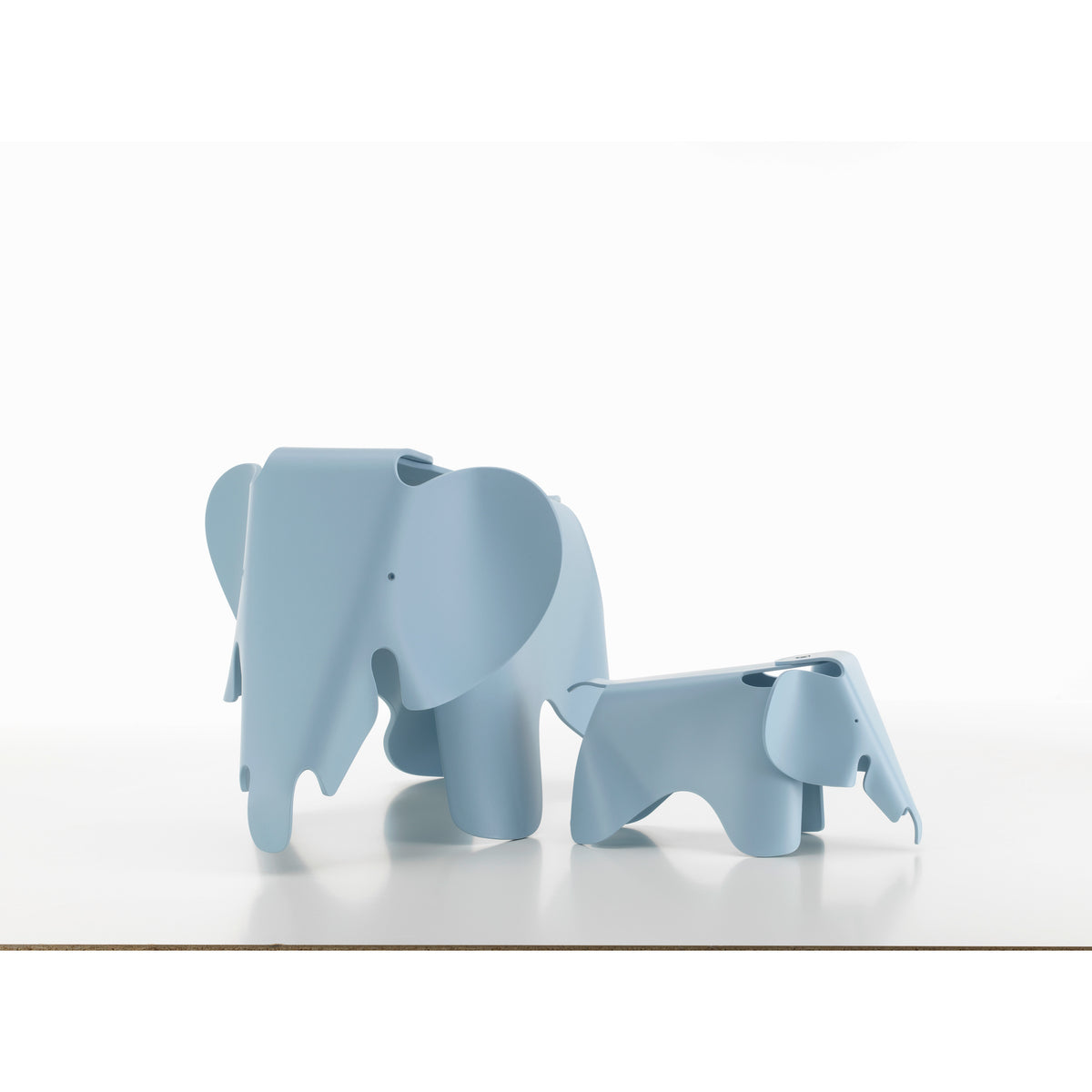 Small RE beside the larger Eames Elephant RE in sky blue; size comparison, sold separately
