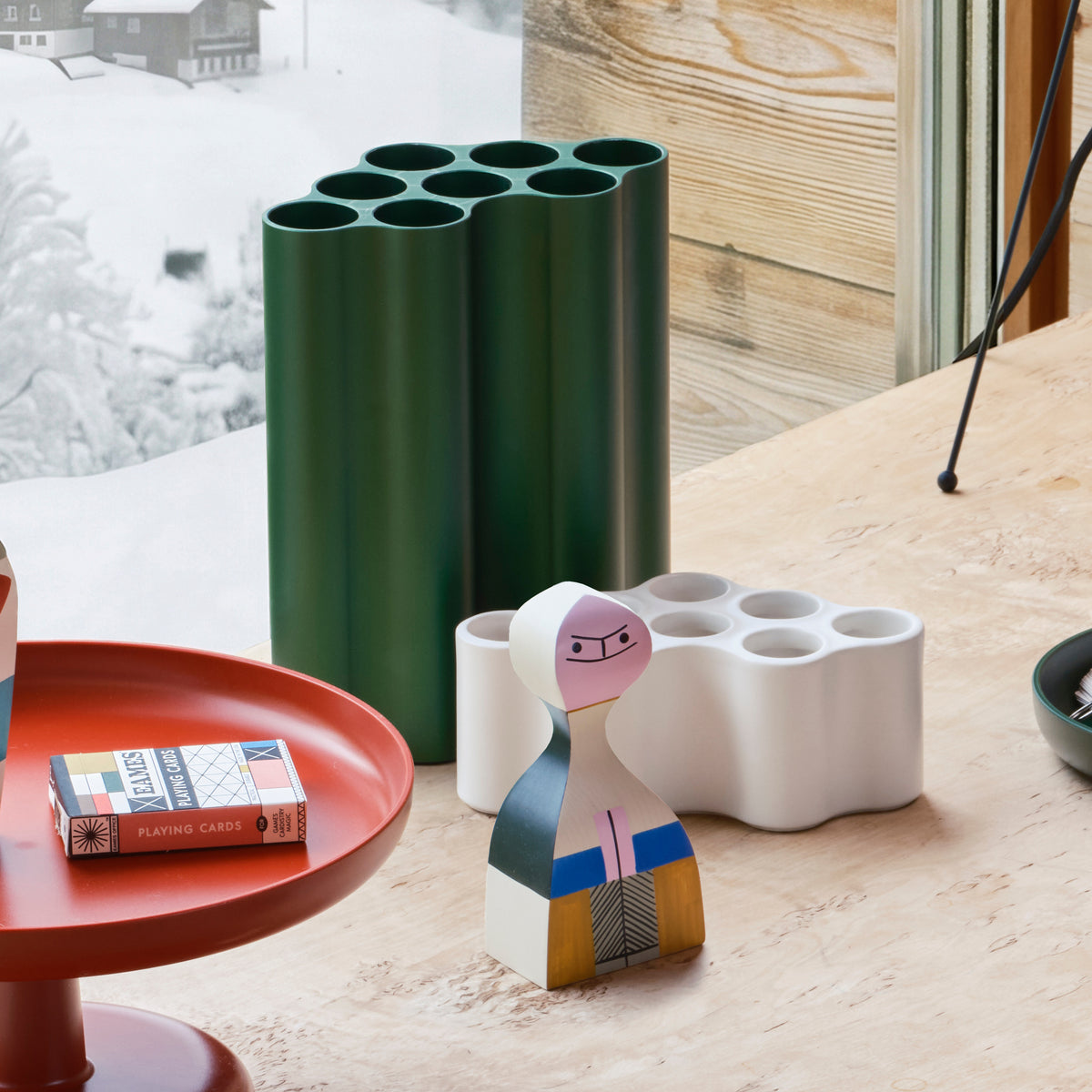 Green Nuage Vase in a holiday display with Wooden Dolls and other accessories