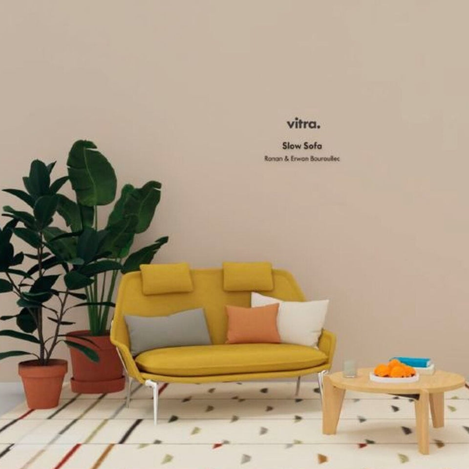 Vitra Slow Sofa in canola upholstery in a styled studio setting