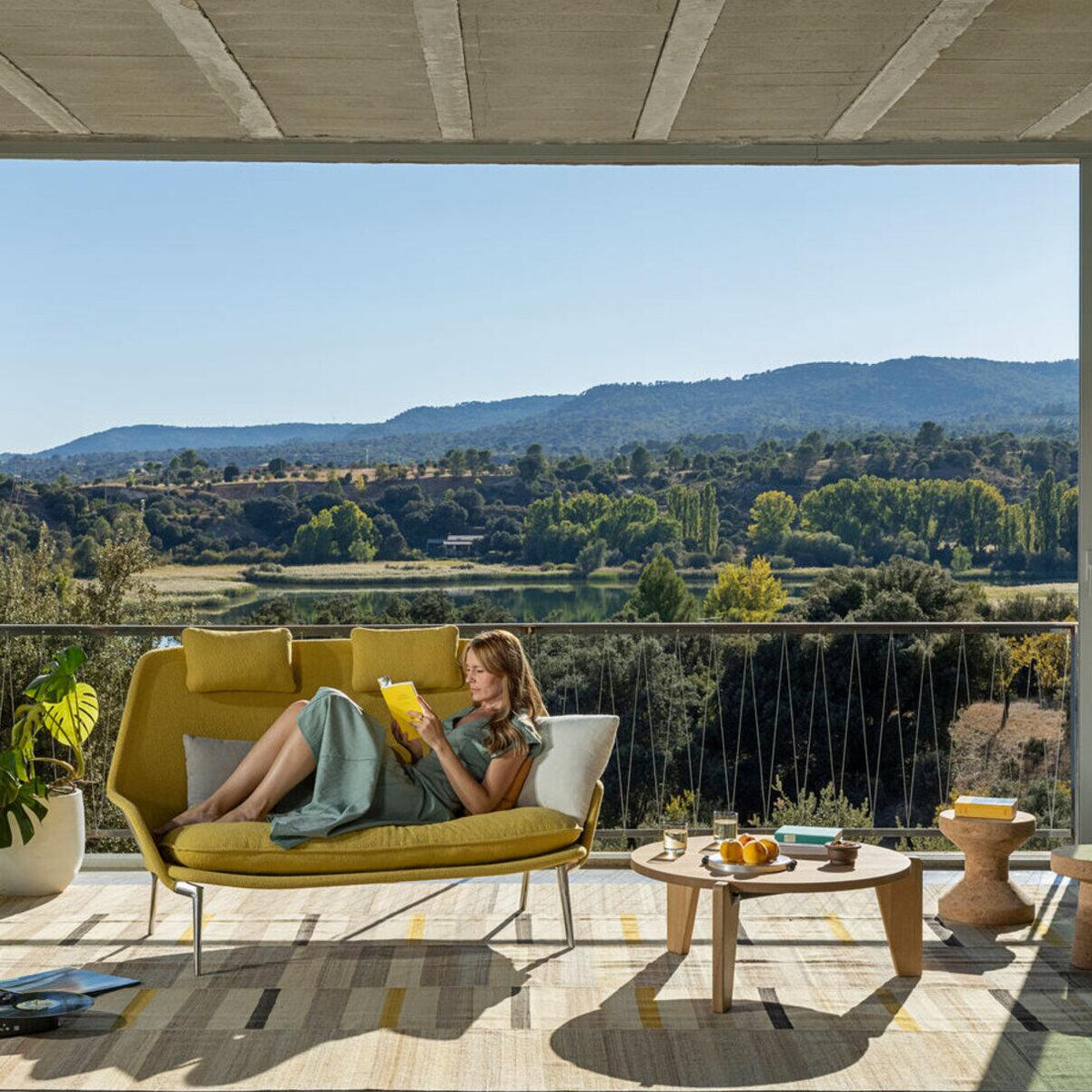 Vitra Slow Sofa in canola Flocca by Ronan and Erwan Bouroullec in a sunlit interior
