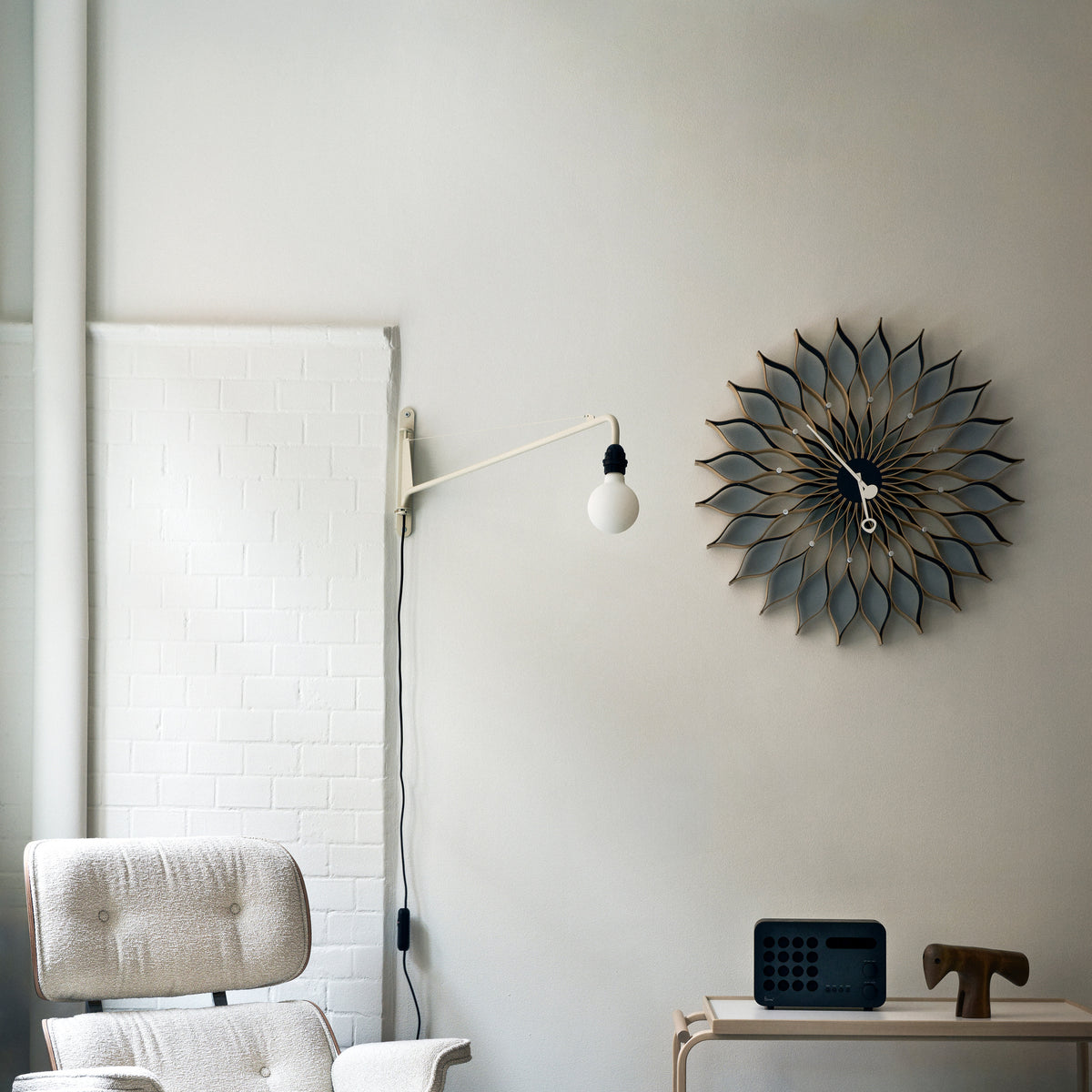 George Nelson Sunflower Clock displayed above a desk in an interior