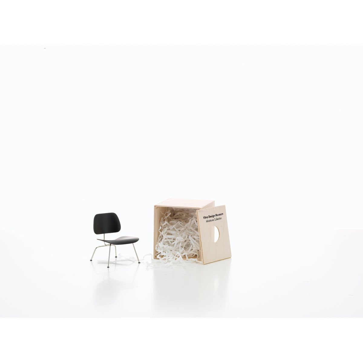 Miniature LCM Chair by Eames for Vitra, 1:6-scale collectible model shown with its presentation box