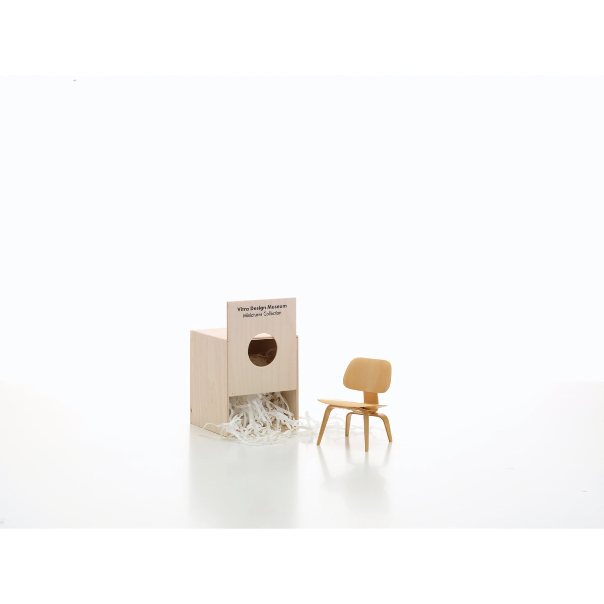 Miniature LCW Chair by Eames for Vitra, 1:6-scale collectible model shown with its presentation box