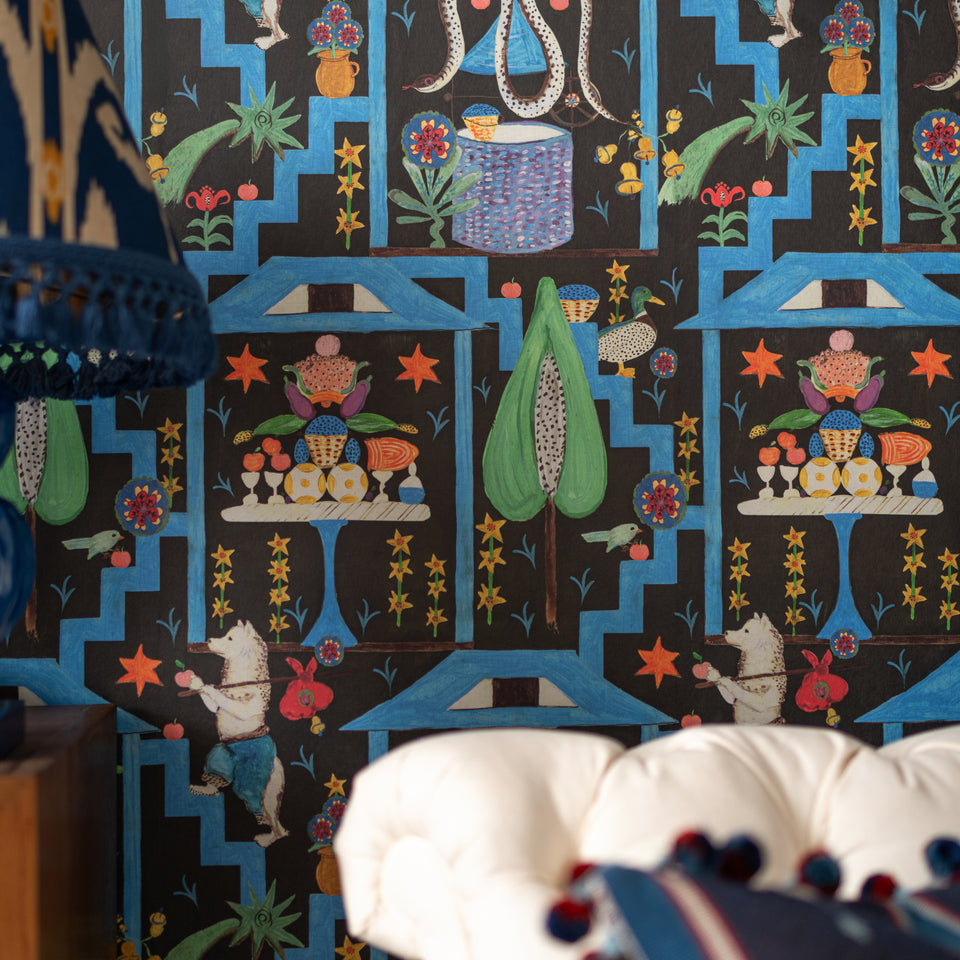 Wonderland Anthracite wallpaper by MINDTHEGAP, close-up in a styled interior.